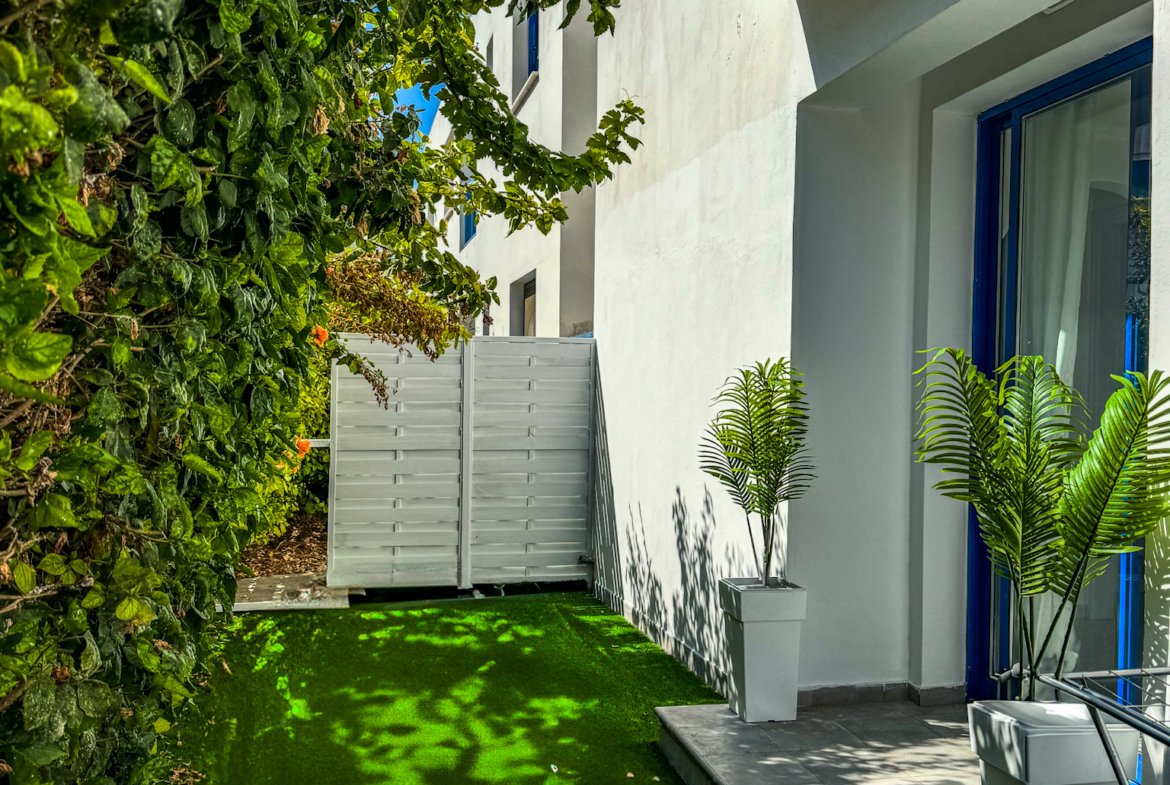 Charming Grecian-Style Ground Floor Apartment in Gated Complex