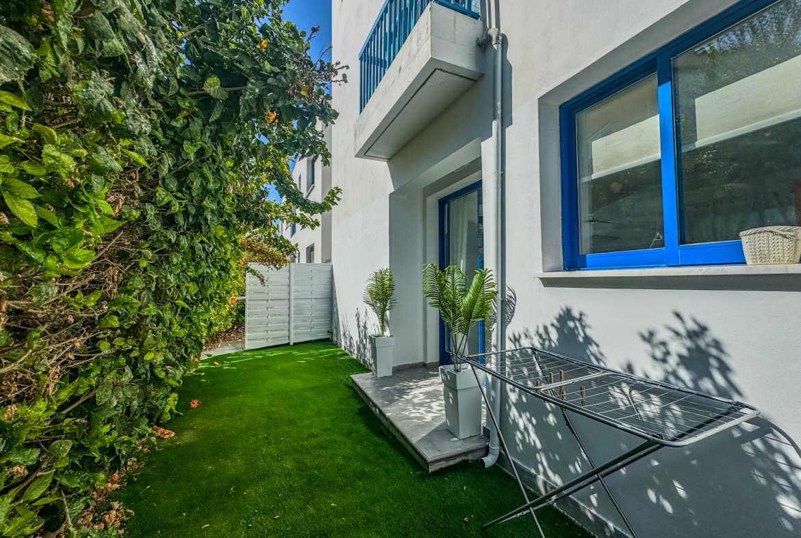 Charming Grecian-Style Ground Floor Apartment in Gated Complex