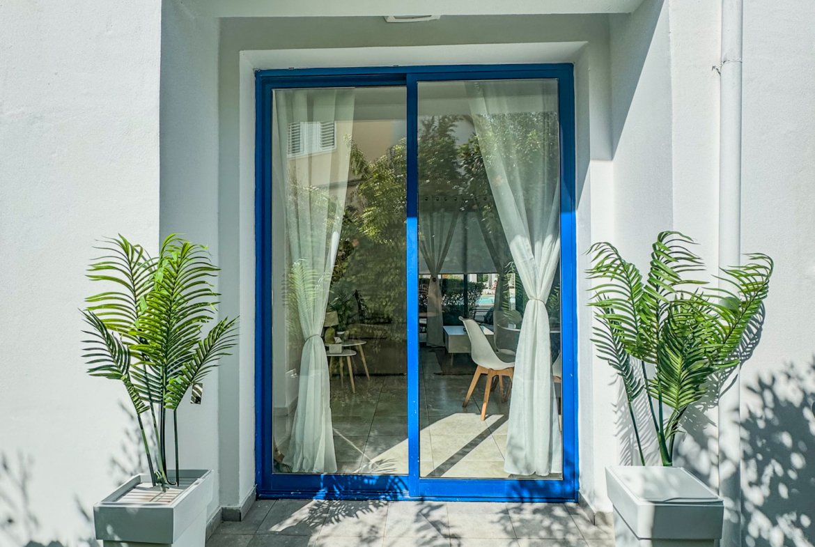 Charming Grecian-Style Ground Floor Apartment in Gated Complex