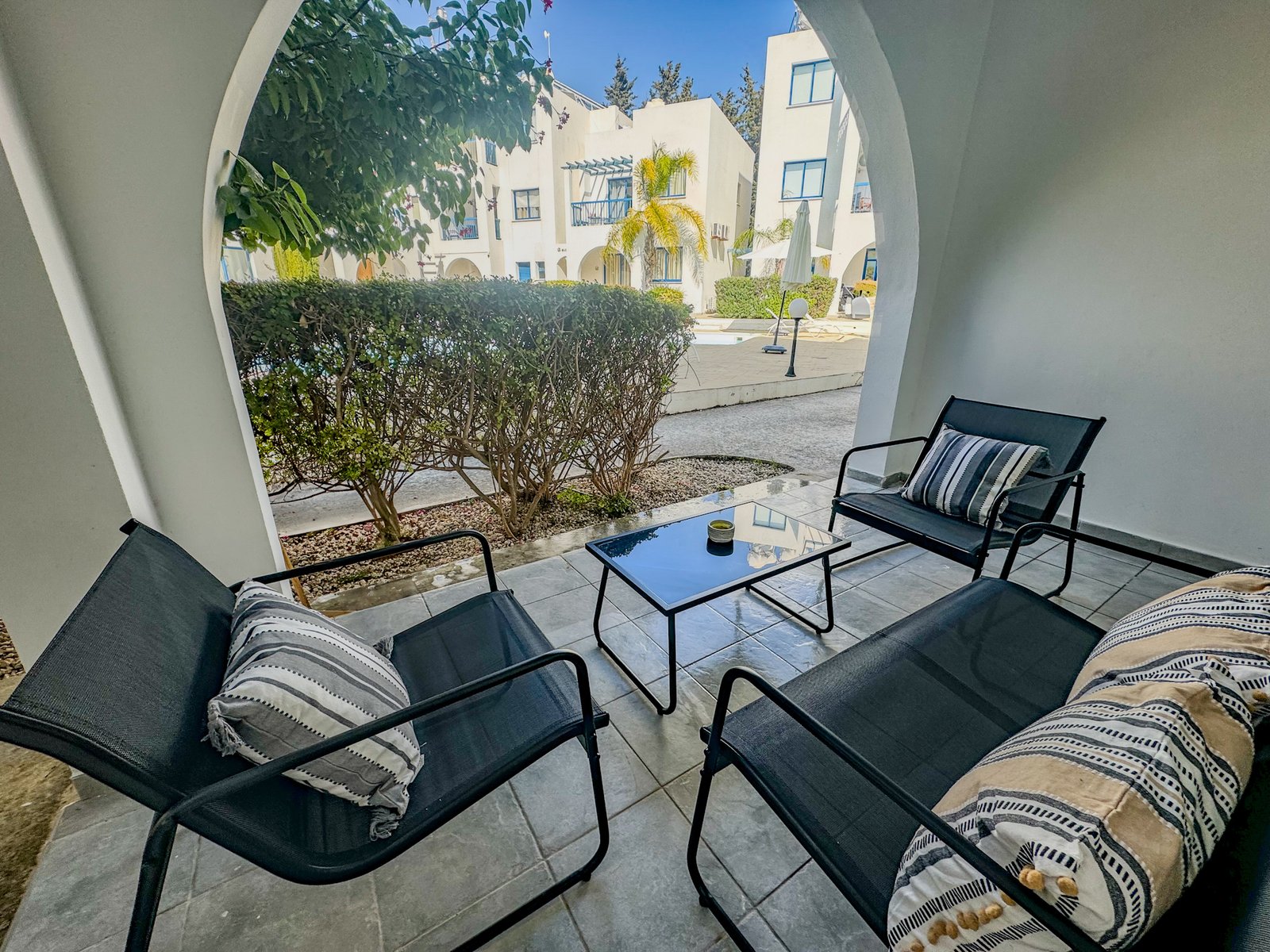 Charming Grecian-Style Ground Floor Apartment in Gated Complex