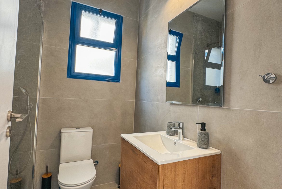 Charming Grecian-Style Ground Floor Apartment in Gated Complex