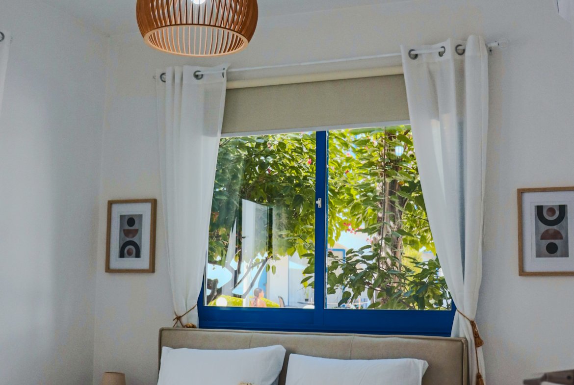 Charming Grecian-Style Ground Floor Apartment in Gated Complex